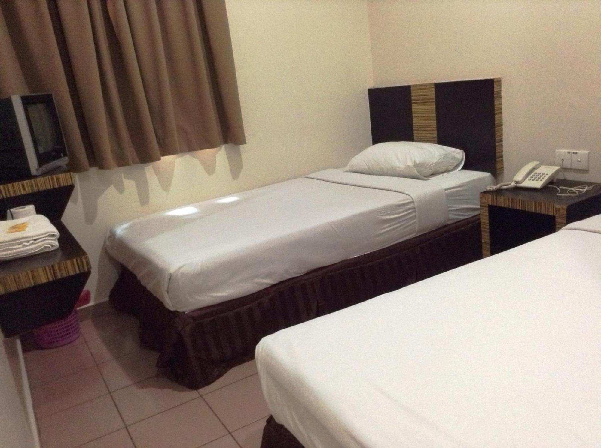 Hotel Traveller Кота-Кинабалу Номер фото